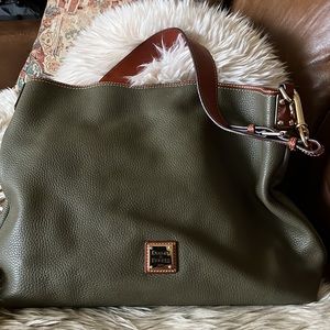 Dooney & Bourke green hobo bag with magnetic closure.